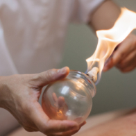 Woman,Preparing,Glass,Cup,With,Fire,For,Cupping,Therapy,,A